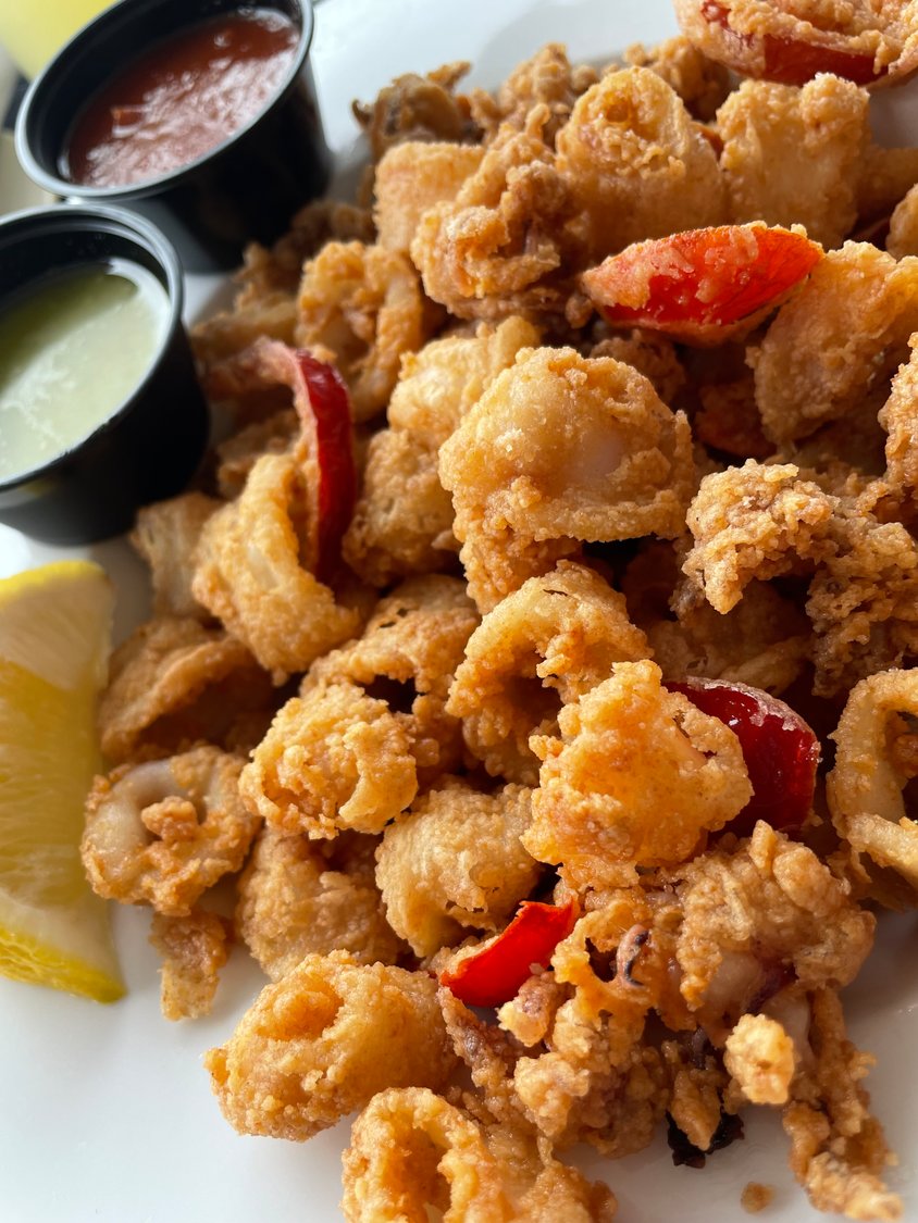The fried calamari served with traditional red sauce and the perfect pesto dip.